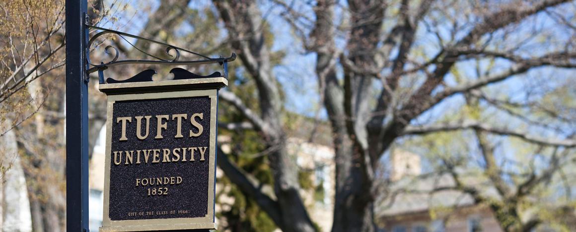 Tufts sign displayed against the quad