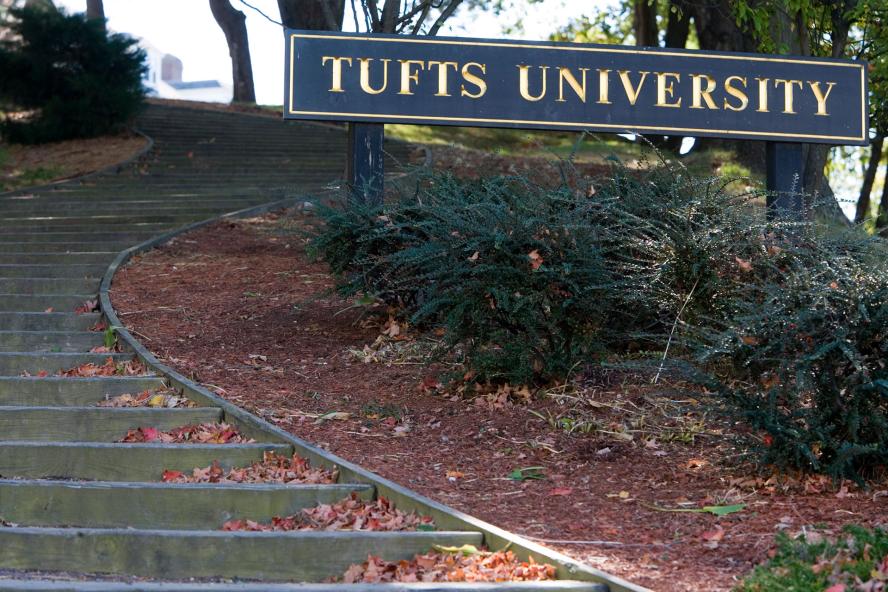 Tufts University sign near a set of stairs