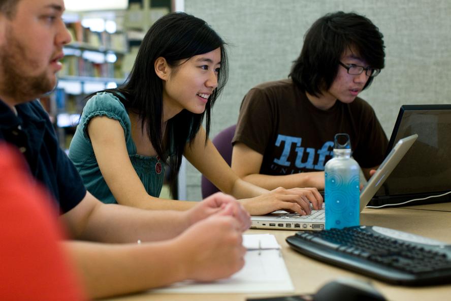 Undergraduates looking at a computer